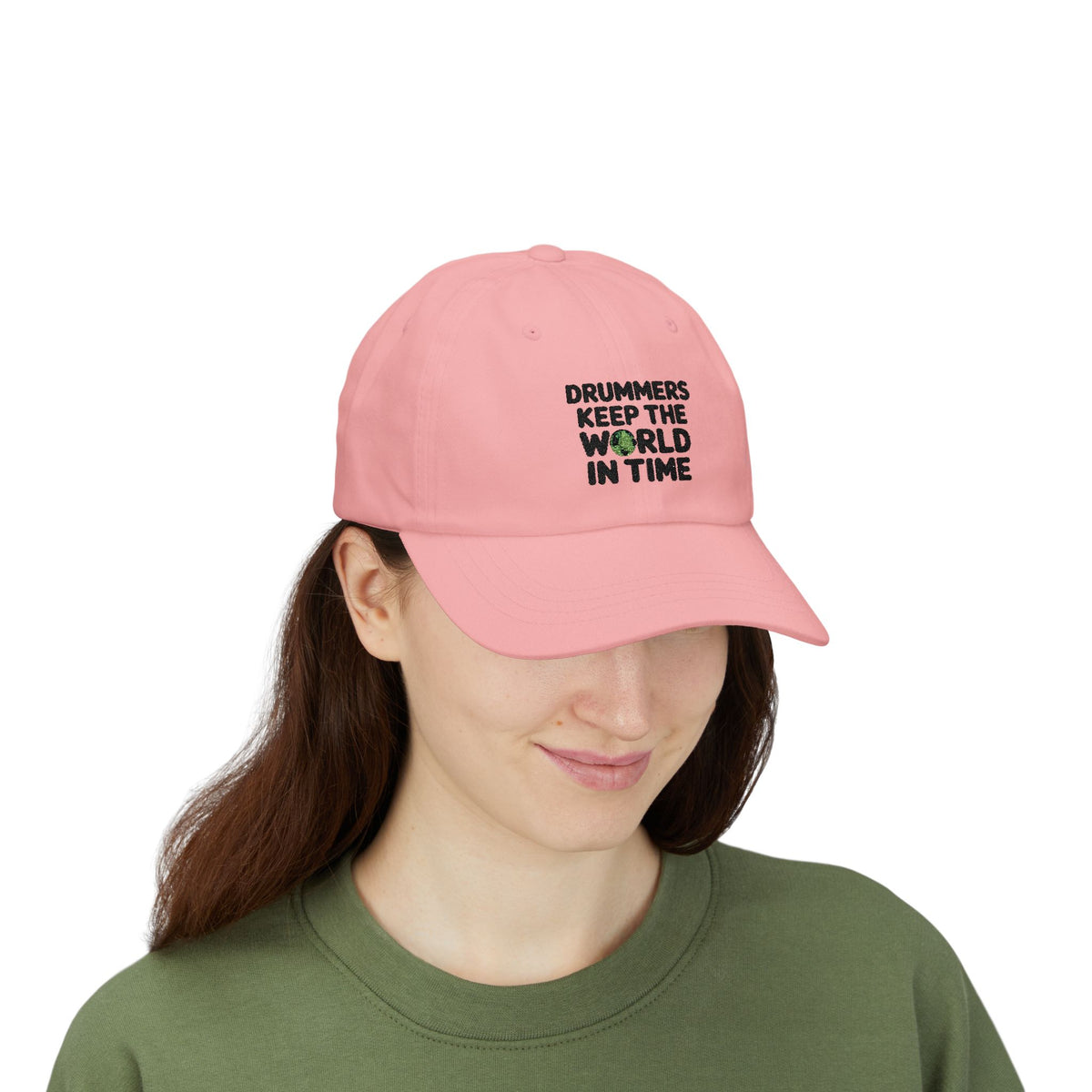 Model wearing a pink cap with text 'Drummers Keep the World in Time'.