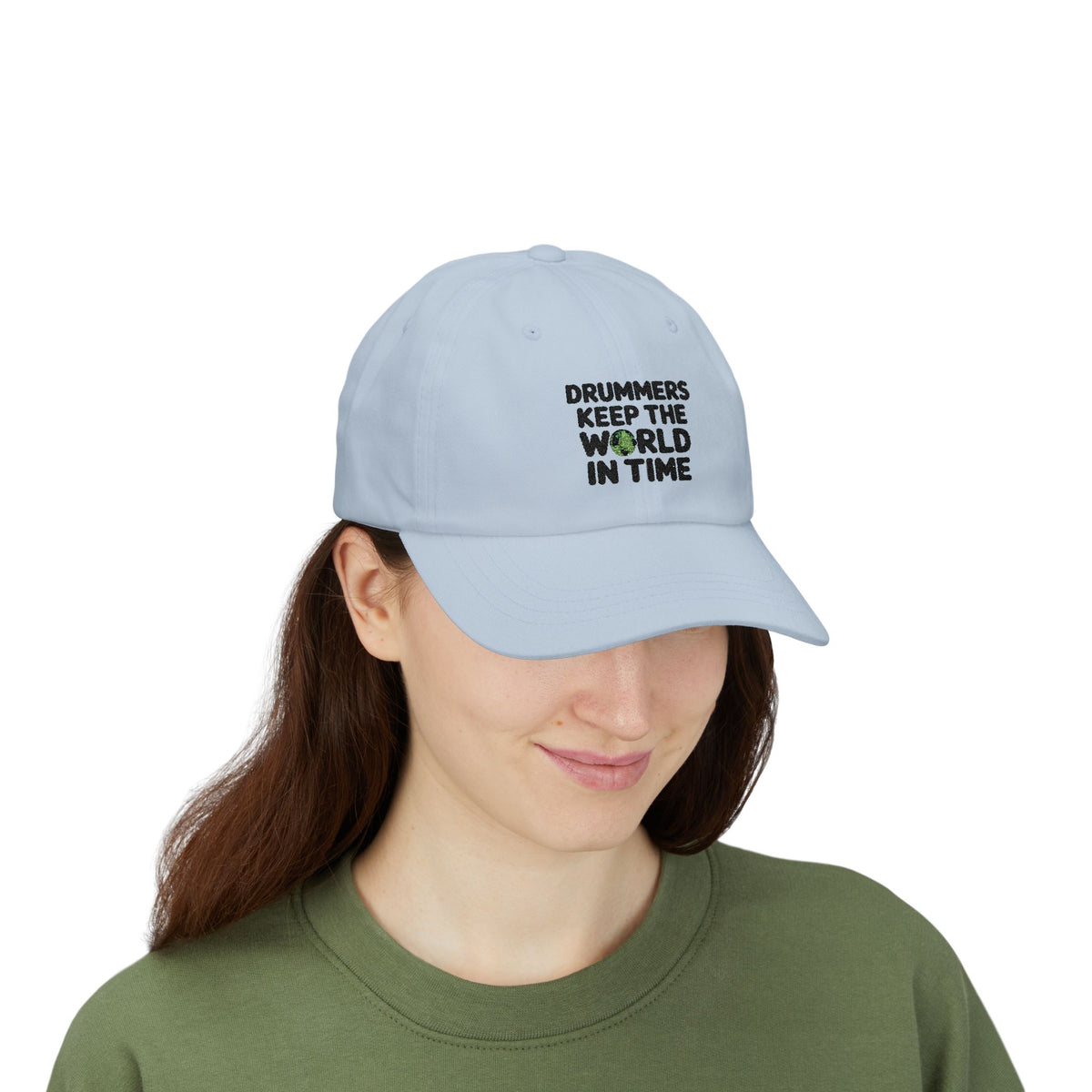 Person wearing a light blue cap with text 'Drummers Keep the World in Time'.