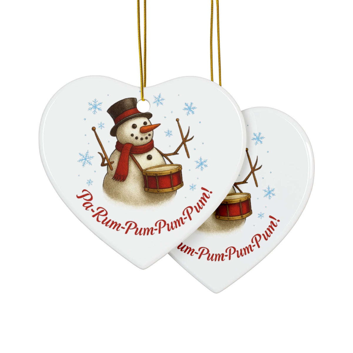 Two heart-shaped Christmas ornaments with a snowman playing drums and text 'Pa-Rum-Pum-Pum-Pum!' on a white background.