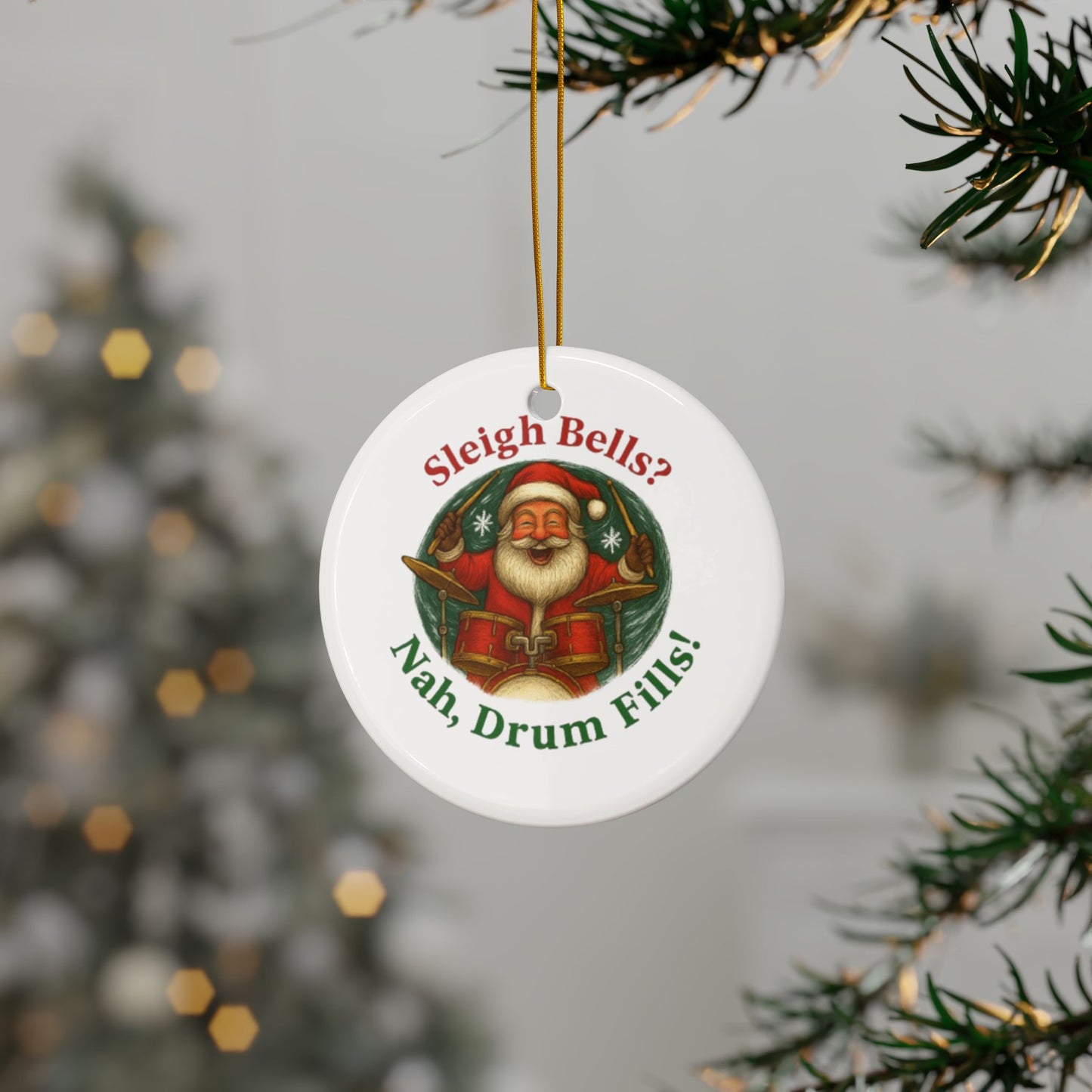 Christmas ornament with Santa Claus and humorous text, hanging on a tree.