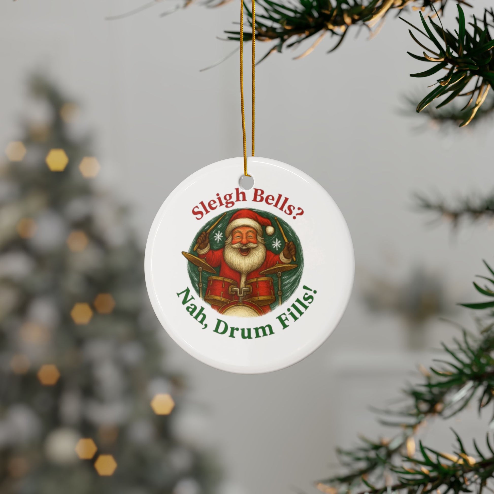 Christmas ornament with Santa Claus and humorous text, hanging on a tree.