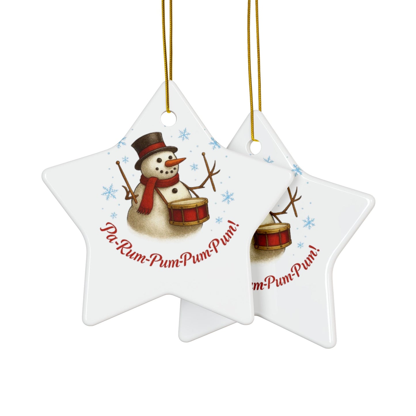 Two star-shaped Christmas ornaments with a snowman and drum design on a white background.