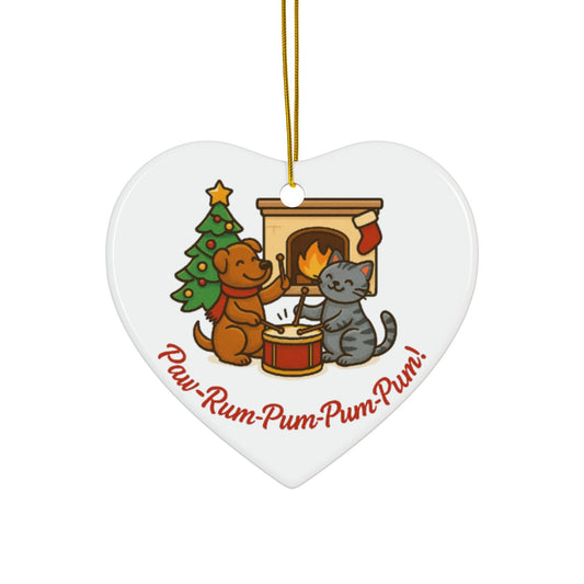 Heart-shaped Christmas ornament with a dog and cat by a fireplace and tree, featuring the text 'Paw-Rum-Pum-Pum-Pum!'.