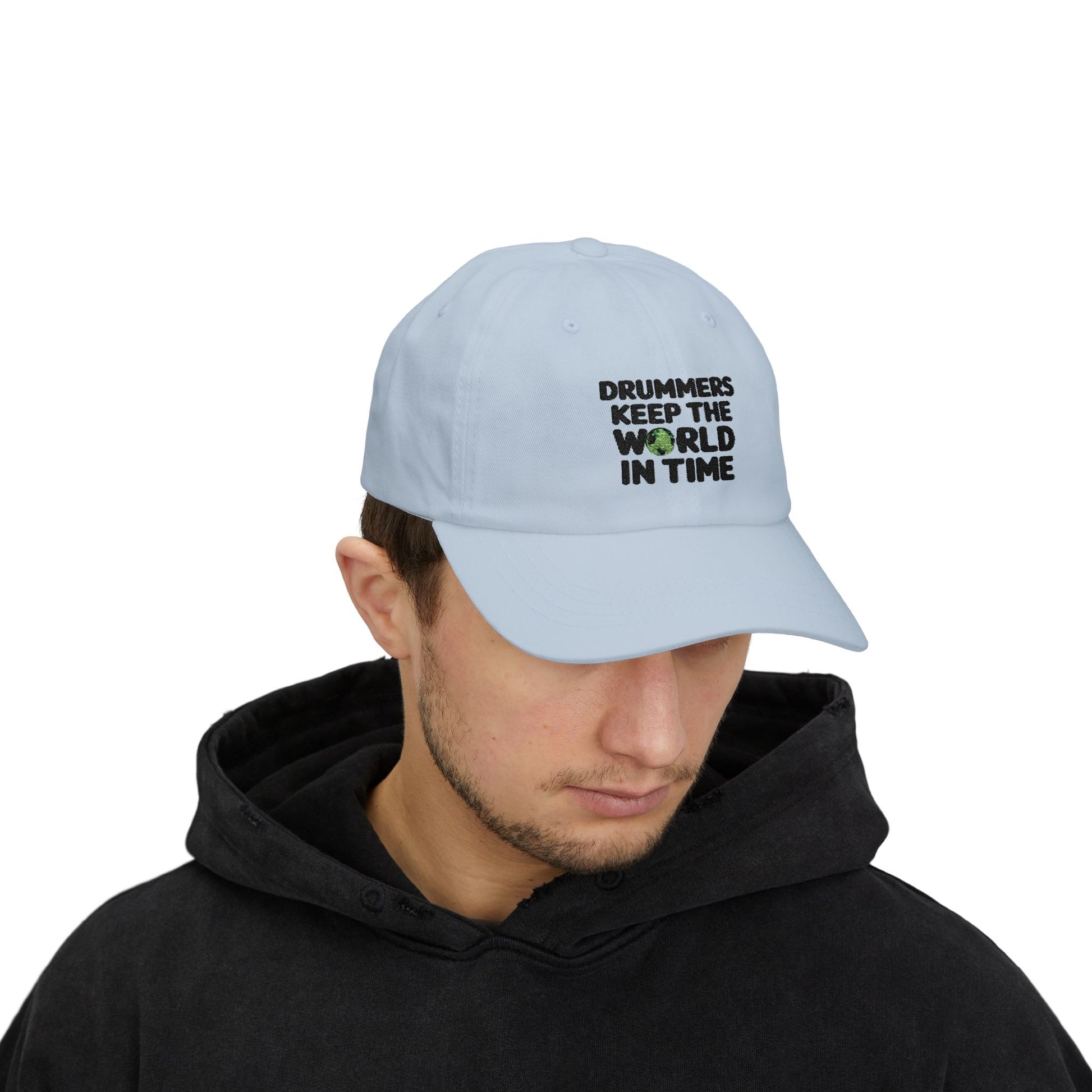 Model wearing a light blue cap with text 'Drummers Keep the World in Time'.